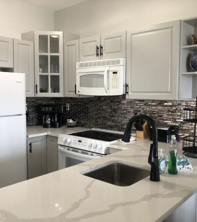 Wide shot of a simple, low budget and affordable remodeled Kitchen.